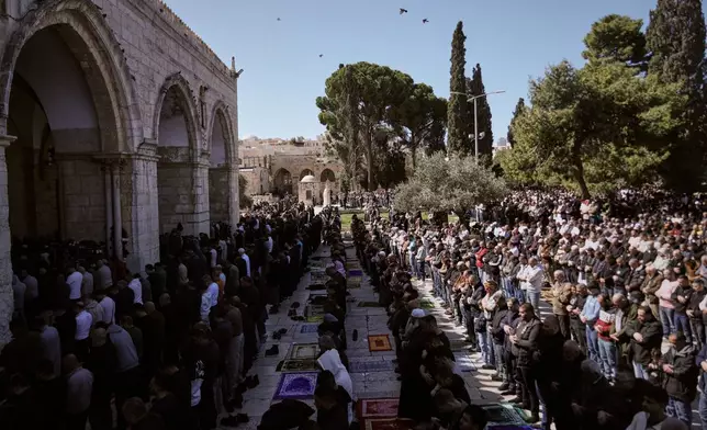 Muslim worshippers offer prayer on the first Friday of the holy month of Ramadan at the Al-Aqsa Mosque compound in Jerusalem's Old City, Friday, Feb. 20, 2026. (AP Photo/Mahmoud Illean)