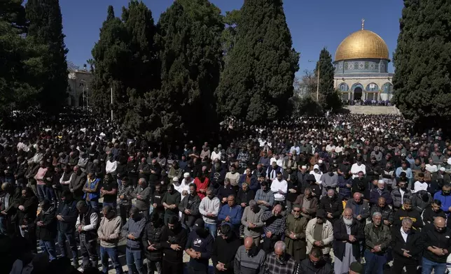 Muslim worshippers offer prayer on the first Friday of the holy month of Ramadan at the Al-Aqsa Mosque compound in Jerusalem's Old City, Friday, Feb. 20, 2026. (AP Photo/Mahmoud Illean)
