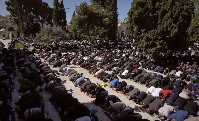 Muslim worshippers offer prayer on the first Friday of the holy month of Ramadan at the Al-Aqsa Mosque compound in Jerusalem's Old City, Friday, Feb. 20, 2026. (AP Photo/Mahmoud Illean)