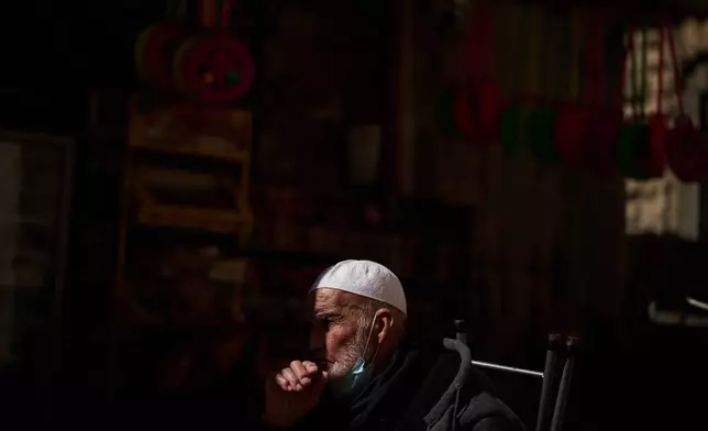 A Muslim worshipper prays outside Al-Aqsa Mosque compound during the holy month of Ramadan, in the Old City of Jerusalem, Friday, Feb. 20, 2026. (AP Photo/Leo Correa)