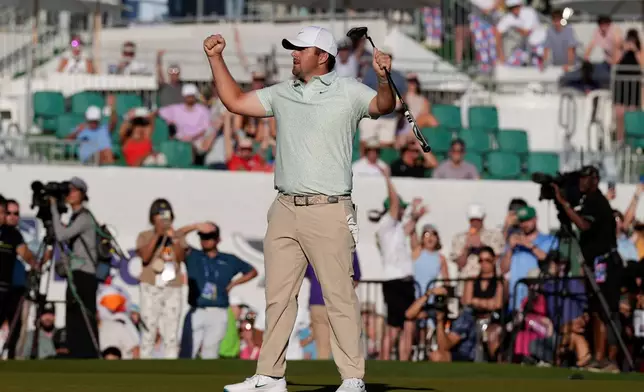 Chris Gotterup celebrates his win after sinking a birdie putt on the first playoff hole at the 18th green during the final round of the Phoenix Open golf tournament Sunday, Feb. 8, 2026, in Scottsdale, Ariz. (AP Photo/Ross D. Franklin)