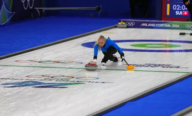 Estonia's Marie Kaldvee in action during the mixed doubles round robin phase of the curling competition against Switzerland, at the 2026 Winter Olympics, in Cortina d'Ampezzo, Italy, Wednesday, Feb. 4, 2026. (AP Photo/Fatima Shbair)