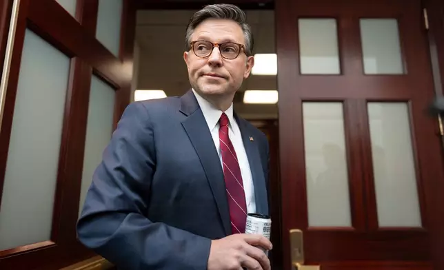 Speaker of the House Mike Johnson, R-La., pauses for questions from reporters as he arrives for an early closed-door Republican Conference meeting on how to end the partial government shutdown and deal with demands over immigration enforcement operations, at the Capitol in Washington, Tuesday, Feb. 3, 2026. (AP Photo/J. Scott Applewhite)