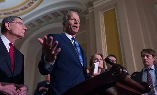 Senate Majority Leader John Thune, R-S.D., center, joined at left by Sen. John Barrasso, R-Wyo., the GOP whip, speaks to reporters following a closed-door GOP strategy session, at the Capitol in Washington, Tuesday, Feb. 3, 2026. (AP Photo/J. Scott Applewhite)