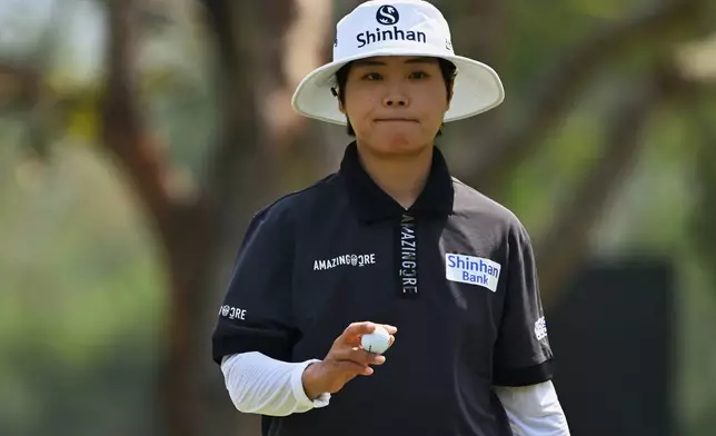 Somi Lee of South Korea reacts after putting the ball on the 14th green during the first round of the LPGA Honda Thailand golf tournament in Pattaya, Thailand, Thursday, Feb. 19, 2026. (AP Photo/Kittinun Rodsupan)