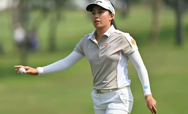 Jeeno Thitikul of Thailand reacts after putting on the first hole during the first round of the LPGA Honda Thailand golf tournament in Pattaya, Thailand, Thursday, Feb. 19, 2026. (AP Photo/Kittinun Rodsupan)