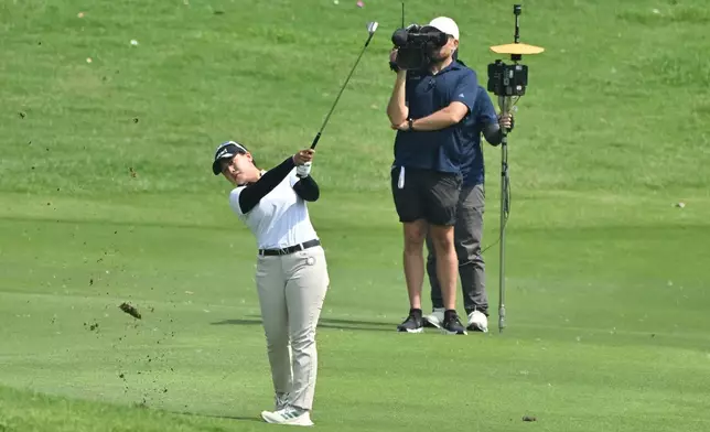 Chanettee Wannasaen of Thailand watches her shot on the 1st green during the first round of the LPGA Honda Thailand golf tournament in Pattaya, Thailand, Thursday, Feb. 19, 2026. (AP Photo/Kittinun Rodsupan)
