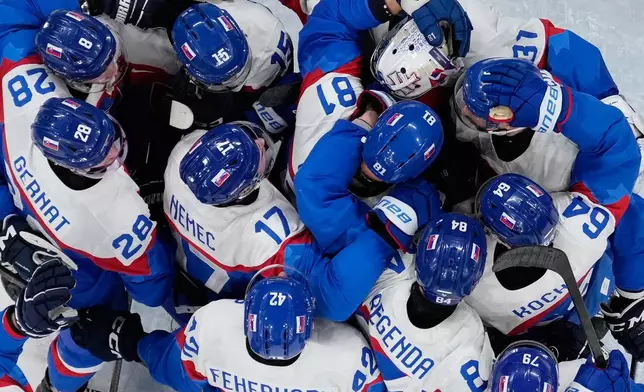 Slovakia players celebrate there victory after a men's ice hockey quarterfinal game between Slovakia and Germany at the 2026 Winter Olympics, in Milan, Italy, Wednesday, Feb. 18, 2026. (AP Photo/Petr David Josek)