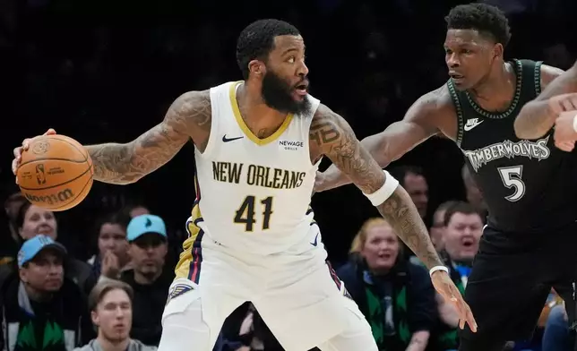 New Orleans Pelicans forward Saddiq Bey (41) works around Minnesota Timberwolves guard Anthony Edwards (5) in the first quarter of an NBA basketball game Friday, Feb. 6, 2026, in Minneapolis. (AP Photo/Bruce Kluckhohn)