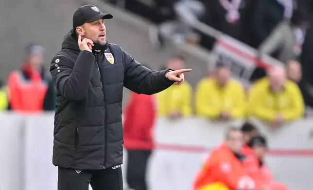 Stuttgart's head coach Sebastian Hoeness gestures during the German Bundesliga soccer match between VfB Stuttgart and SC Freiburg in Stuttgart, Germany, Sunday, Feb. 1, 2026. (Harry Langer/dpa via AP)