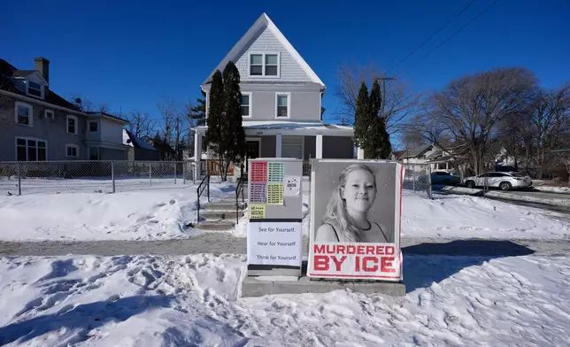 A photo of Renee Good is displayed in front of a home on Saturday, Jan. 31, 2026, in Minneapolis. (AP Photo/Alex Brandon)