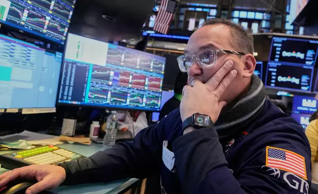 Specialist Anthony Matesic works at his post on the floor of the New York Stock Exchange, Friday, Feb. 6, 2026. (AP Photo/Richard Drew)