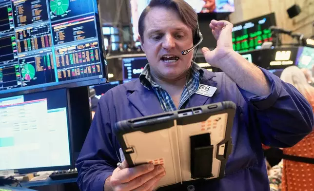 Trader Michael Milano works on the floor of the New York Stock Exchange, Friday, Feb. 6, 2026. (AP Photo/Richard Drew)