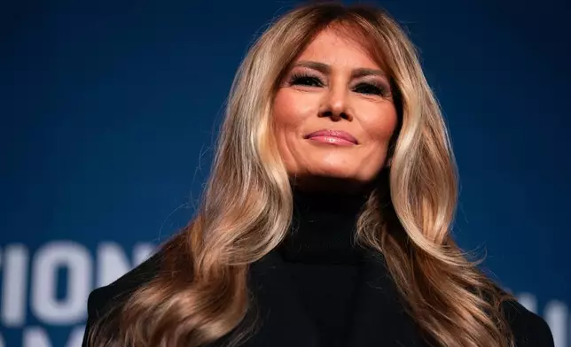First lady Melania Trump speaks at an event to present her 2025 inaugural ball gown to the Smithsonian National Museum of American History, Friday, Feb. 20, 2026, in Washington. (AP Photo/Allison Robbert)