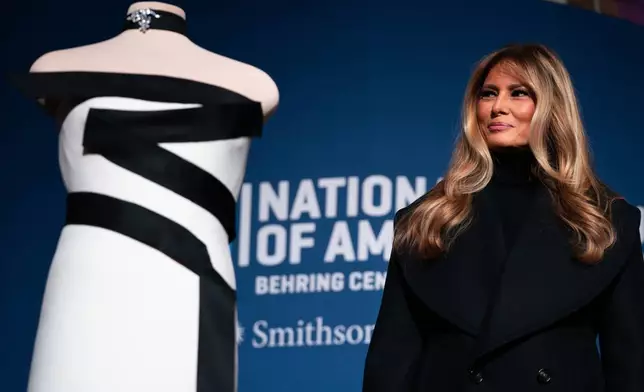 First lady Melania Trump presents her 2025 inaugural ball gown to the Smithsonian National Museum of American History, Friday, Feb. 20, 2026, in Washington. (AP Photo/Allison Robbert)