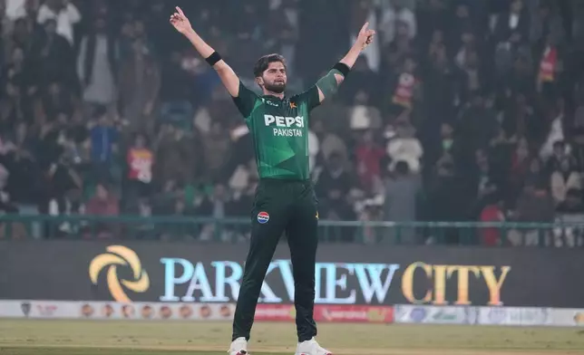 Pakistan's Shaheen Shah Afridi celebrates after taking the wicket of Australia's Matt Renshaw during the third T20 cricket match between Pakistan and Australia, in Lahore, Pakistan, Sunday, Feb. 1, 2026. (AP Photo/K.M. Chaudary)