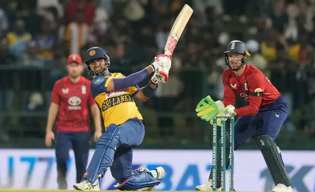 Sri Lanka's captain Dasun Shanaka plays a shot during the third T20 cricket match between England and Sri Lanka in Pallekele, Sri Lanka, Tuesday, Feb, 3. 2026. (AP Photo/Eranga Jayawardena)