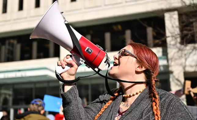 People gather outside the U.S. District Courthouse in St. Paul, Minn., in support of journalist Don Lemon and Nekima Levy Armstrong ahead of their hearing Friday, Feb. 13, 2026. (AP Photo/Tom Baker)