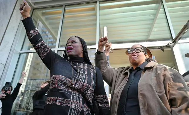 Nekima Levy Armstrong, left, speaks to the media alongside Chauntyll Allen, right, outside the U.S. District Courthouse in St. Paul, Minn., Friday, Feb. 13, 2026. (AP Photo/Tom Baker)