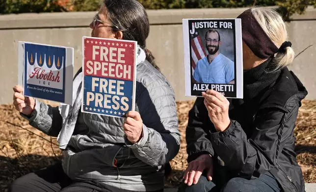 People gather outside the U.S. District Courthouse in St. Paul, Minn., in support of journalist Don Lemon and Nekima Levy Armstrong ahead of their hearing Friday, Feb. 13, 2026. (AP Photo/Tom Baker)