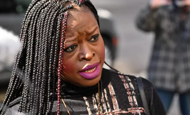Nekima Levy Armstrong, center, speaks outside the U.S. District Courthouse in St. Paul, Minn., Friday, Feb. 13, 2026. (AP Photo/Tom Baker)