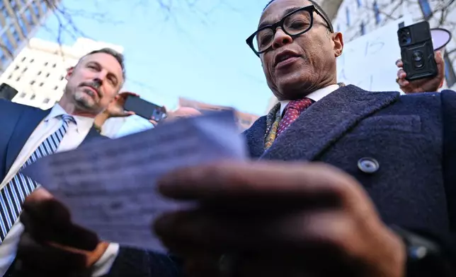 Journalist Don Lemon, right, speaks to the media outside the U.S. District Courthouse in St. Paul, Minn., Friday, Feb. 13, 2026. (AP Photo/Tom Baker)