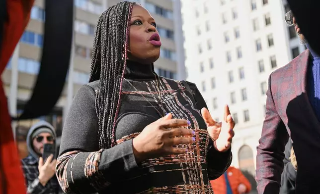 Nekima Levy Armstrong, center, speaks outside the U.S. District Courthouse in St. Paul, Minn., Friday, Feb. 13, 2026. (AP Photo/Tom Baker)