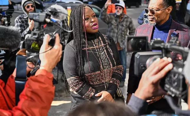 Nekima Levy Armstrong, center, speaks outside the U.S. District Courthouse in St. Paul, Minn., Friday, Feb. 13, 2026. (AP Photo/Tom Baker)