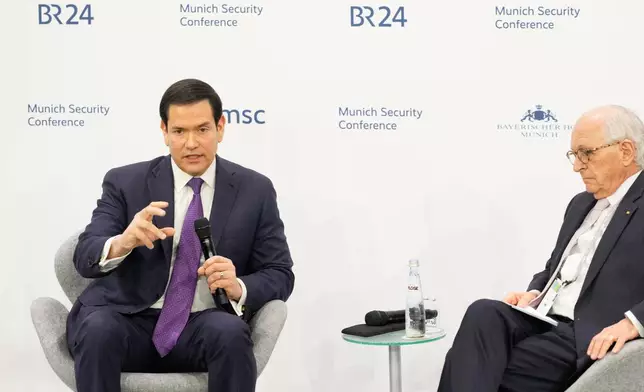 U.S. Secretary of State Marco Rubio speaks, next to the Chairman of the Munich Security Conference Wolfgang Ischinger, at the Munich Security Conference in Munich, Germany, Saturday, Feb. 14, 2026. (AP Photo/Alex Brandon, Pool)