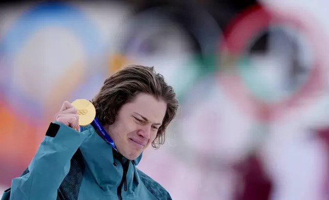 Brazil's Lucas Pinheiro Braathen is overcome by emotion as he holds his gold medal for an alpine ski, men's giant slalom race, at the 2026 Winter Olympics, in Bormio, Italy, Saturday, Feb. 14, 2026.(AP Photo/Julia Demaree Nikhinson)