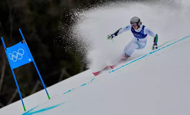 Brazil's Lucas Pinheiro Braathen speeds down the course, during an alpine ski, men's giant slalom race, at the 2026 Winter Olympics, in Bormio, Italy, Saturday, Feb. 14, 2026. (AP Photo/John Locher)