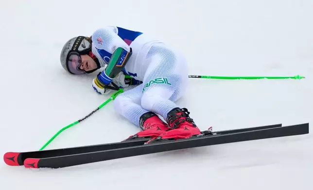 Brazil's Lucas Pinheiro Braathen celebrates winning an alpine ski, men's giant slalom race, at the 2026 Winter Olympics, in Bormio, Italy, Saturday, Feb. 14, 2026. (AP Photo/John Locher)