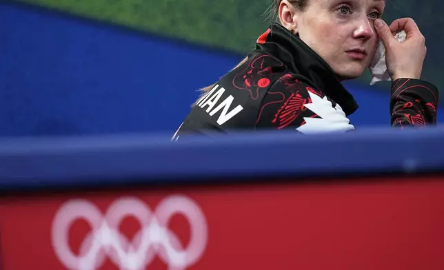 Canada's Jocelyn Peterman reacts during the mixed doubles round robin phase of the curling competition against Sweden, at the 2026 Winter Olympics, in Cortina d'Ampezzo, Italy, Sunday, Feb. 8, 2026. (AP Photo/Fatima Shbair)