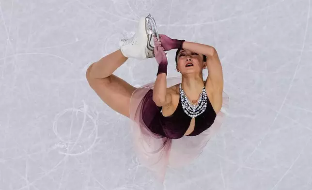 Kaori Sakamoto of Japan competes during the figure skating women's team event at the 2026 Winter Olympics, in Milan, Italy, Sunday, Feb. 8, 2026. (AP Photo/Bernat Armangue)