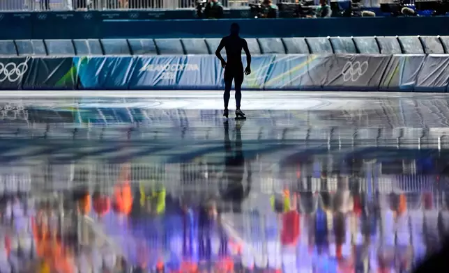 A forerunner prepares to skate a test lap ahead of the men's 5,000 meters speedskating race at the 2026 Winter Olympics, in Milan, Italy, Sunday, Feb. 8, 2026. (AP Photo/Ben Curtis)