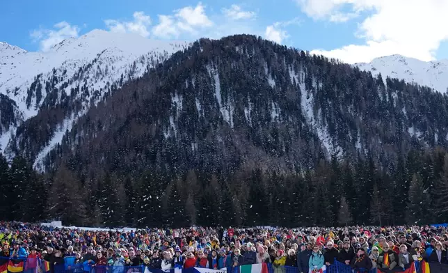 Spectators line the course of the 4X6-kilometer mixed relay biathlon race at the 2026 Winter Olympics in Anterselva, Italy, Sunday, Feb. 8, 2026. (AP Photo/Mosa'ab Elshamy)