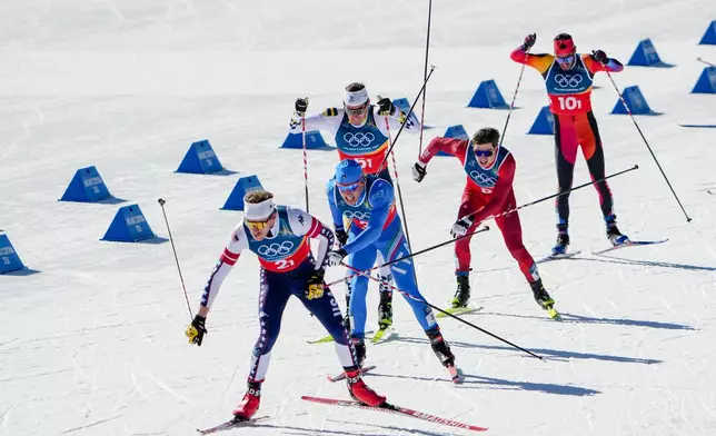 Ben Ogden, of the United States, from left, Elia Barp, of Italy, Johan Haeggstroem, of Sweden, Janik Riebli, of Switzerland, and Antoine Cyr, of Canada, compete in the cross-country skiing men's team sprint free at the 2026 Winter Olympics, in Tesero, Italy, Wednesday, Feb. 18, 2026. (AP Photo/Matthias Schrader)
