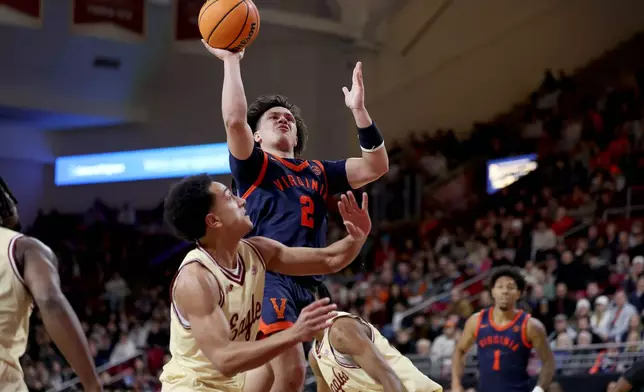 Virginia guard Chance Mallory (2) scores during the first half of an NCAA college basketball game against Boston College, Saturday, Jan. 31, 2026, in Boston. (AP Photo/Mark Stockwell)