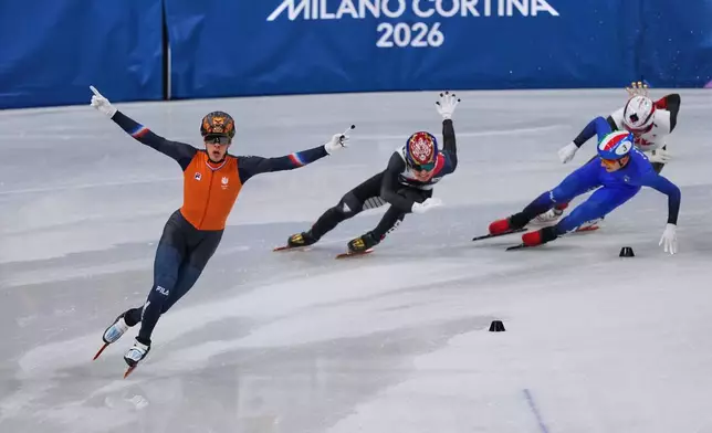 Jens van 't Wout of the Netherlands celebrates during a short track speed skating men's 5000 meters relay final at the 2026 Winter Olympics, in Milan, Italy, Friday, Feb. 20, 2026. (AP Photo/Stephanie Scarbrough)