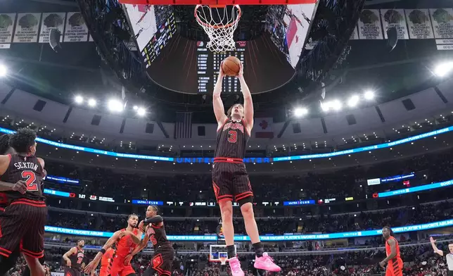 Chicago Bulls guard Josh Giddey (3) grabs a rebound against the Portland Trail Blazers during the first quarter in an NBA basketball game Thursday, Feb. 26, 2026, in Chicago. (AP Photo/David Banks)