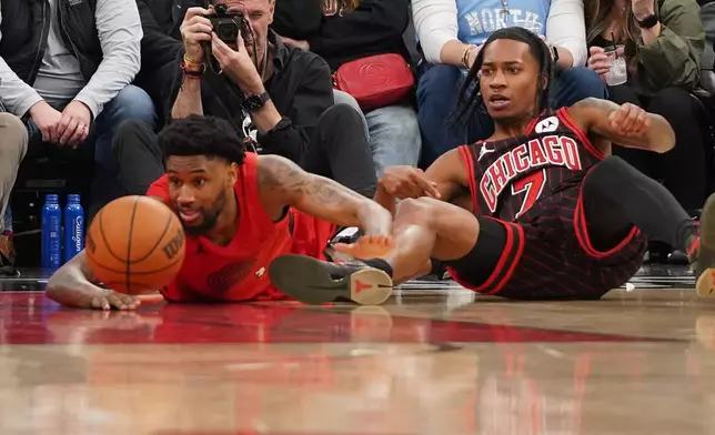 Portland Trail Blazers guard Blake Wesley, left, and Chicago Bulls Rob Dillingham (7) go for the ball during the second half in an NBA basketball game Thursday, Feb. 26, 2026, in Chicago. (AP Photo/David Banks)