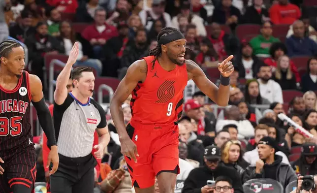 Portland Trail Blazers forward Jerami Grant (9) gestures after making a three point basket against the Chicago Bulls during the second half in an NBA basketball game Thursday, Feb. 26, 2026, in Chicago. (AP Photo/David Banks)