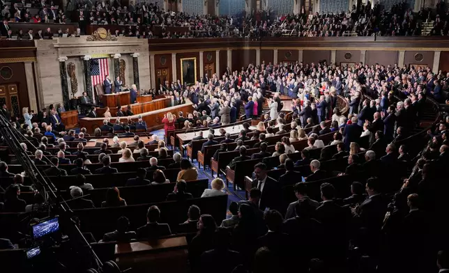 Republican members of Congress stand while Democrats keep their seats during President Donald Trump¥s State of the Union address to a joint session of Congress in the House chamber at the U.S. Capitol in Washington, Tuesday, Feb. 24, 2026. (AP Photo/Alex Brandon)