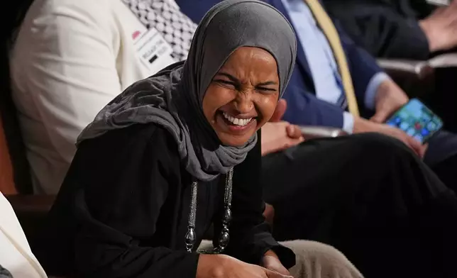 Rep. Ilhan Omar, D-Minn., listens as President Donald Trump delivers the State of the Union address to a joint session of Congress in the House chamber at the U.S. Capitol in Washington, Tuesday, Feb. 24, 2026. (AP Photo/Matt Rourke)
