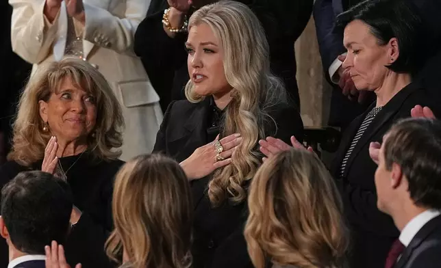 Erika Kirk gestures as President Donald Trump delivers the State of the Union address to a joint session of Congress in the House chamber at the U.S. Capitol in Washington, Tuesday, Feb. 24, 2026. (AP Photo/Matt Rourke)
