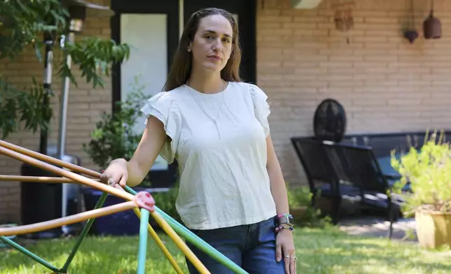 Angela Juergens poses for a photo at her home, Monday, Aug. 25, 2025, in Dallas. (AP Photo/Tony Gutierrez)