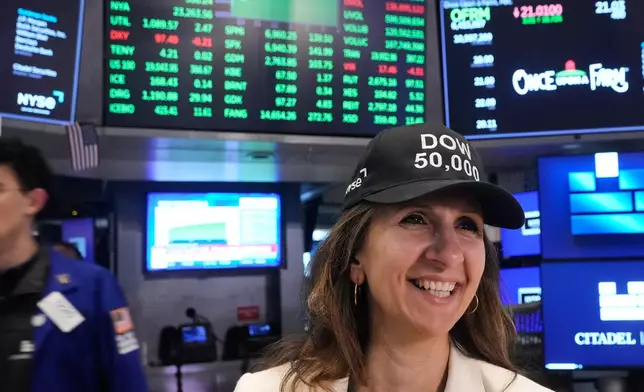 NYSE President Lynn Martin wears a "DOW 50,000" cap to watch closing bell ceremonies as the Dow Jones industrial average closed above the 50,000 level for the first time, Friday, Feb. 6, 2026. (AP Photo/Richard Drew)