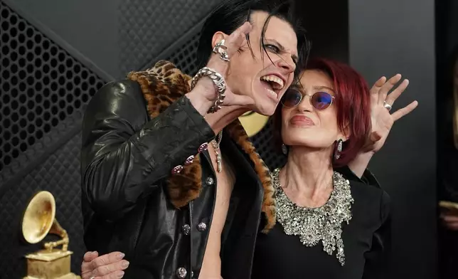 Yungblud, left, and Sharon Osbourne arrive at the 68th annual Grammy Awards on Sunday, Feb. 1, 2026, in Los Angeles. (Photo by Jordan Strauss/Invision/AP)