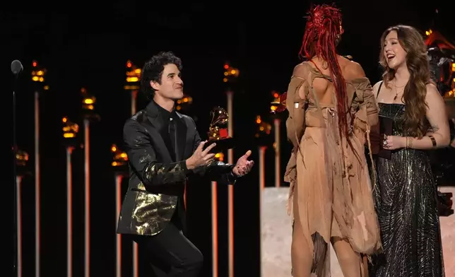 Host Darren Criss, left, presents the award for best dance/electronic album to FKA Twigs for "EUSEXUA" during the 68th annual Grammy Awards on Sunday, Feb. 1, 2026, in Los Angeles. (AP Photo/Chris Pizzello)