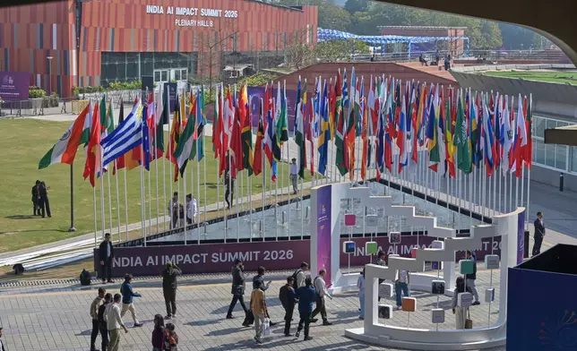 Delegates arrive for an AI Impact Summit in New Delhi, India, Tuesday, Feb.17, 2026. (AP Photo)